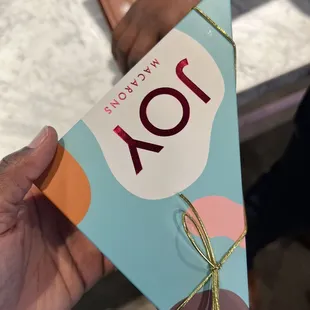 a person holding a chocolate bar