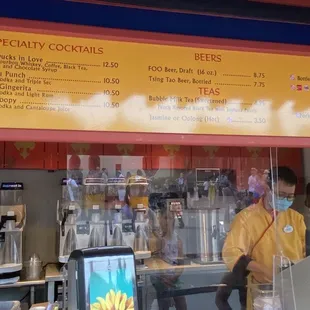 a man standing in front of a coffee shop
