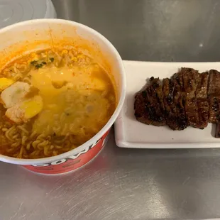 Korean spicy ramen with egg, cheese &amp; beef steak