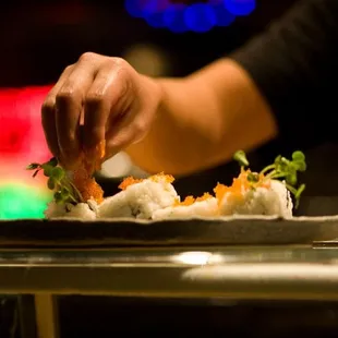 Sprinkling on tobiko.