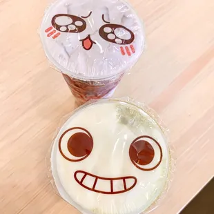 a cup of coffee with a face drawn on it