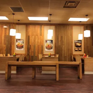a restaurant with wooden walls
