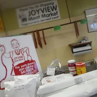 a sign for joy view meat market