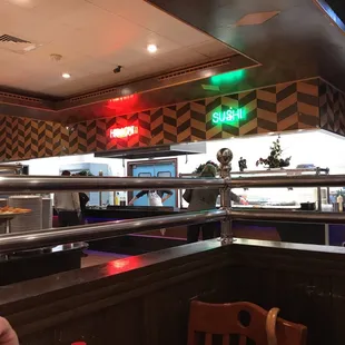 a woman sitting at a table in a restaurant