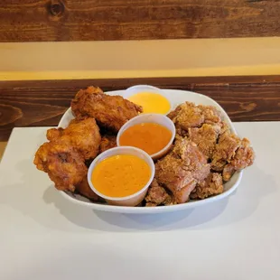 Popcorn Chicken, and Chicken Wings with choice of sauces.