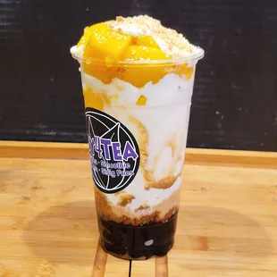 Mango Smoothie with Crushed Graham, Boba Pearls, Caramel Crema.