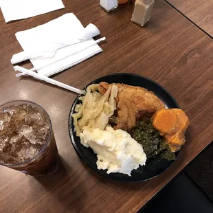 My dish. I honestly don&apos;t normally eat that much! Shown is the fried chicken, mashed, cabbage, collard greens and sweet potatoes.