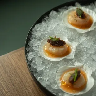 Hokkaido Scallops on the Halfshell 

citrus, mirin, benne seeds, charred fennel relish