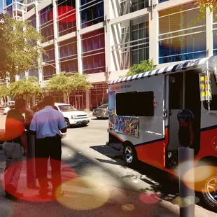 an ice cream truck on a city street
