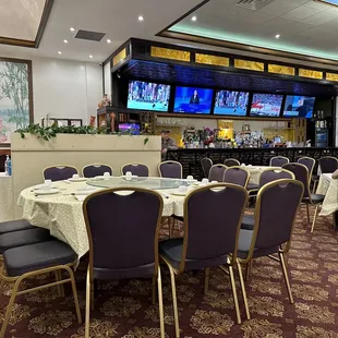 a dining room with tables and chairs