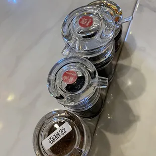 a variety of condiments on a table