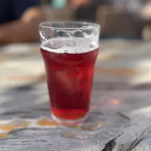 a red drink in a glass