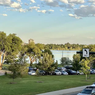 a view of a parking lot with a lake in the background