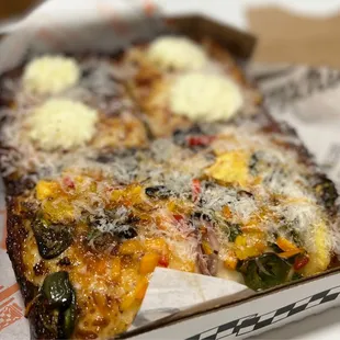 a slice of pizza in a box