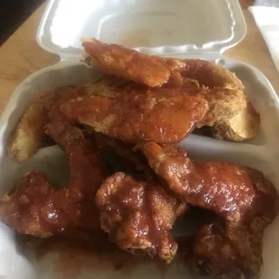chicken wings in a styrofoam container