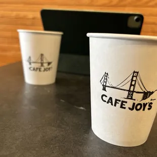 a coffee cup and a cell phone