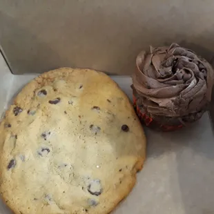 Huge chocolate chip cookie and chocolate cupcake to go.