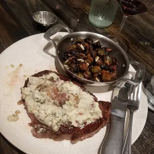 10 oz ribery with blue cheese butter and baby brussel sprouts