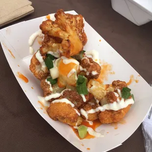 Buffalo cauliflower tipped off with blue cheese and green onions!