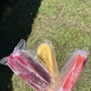 a person holding a popsicle