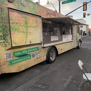 a food truck parked on the side of the road
