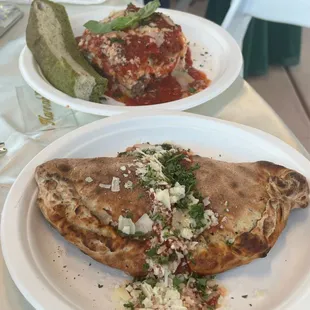 Lasagna with focaccia bread. Calzone.