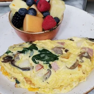 3 egg omelet and fruit cup from the breakfast menu.