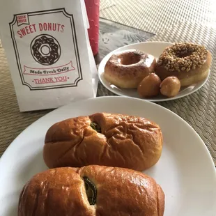 a plate of doughnuts and a bagel