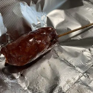 a hot dog on a stick