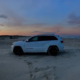 One of my favorite shots. Be attentive to how soft or deep the sand looks, take notice where &amp; how far in other cars are parked.