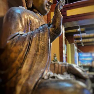 A beautiful Gautama Buddha Statue Making Sure Every Bite Is A Good Bite! (She whispered to me that licking your plate is acceptable here)