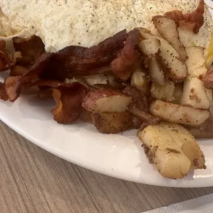 Some sort of smothered breakfast dish.