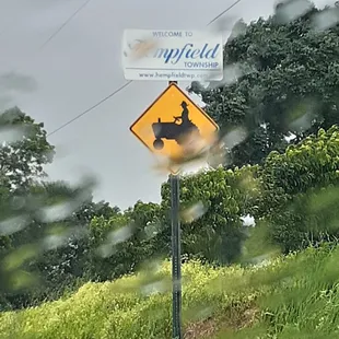a sign with a tractor on it