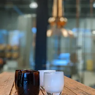 two coffee cups on a wooden table