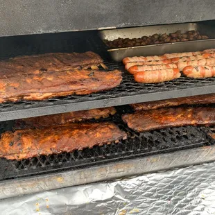 Ribs and bacon wrapped hot links.