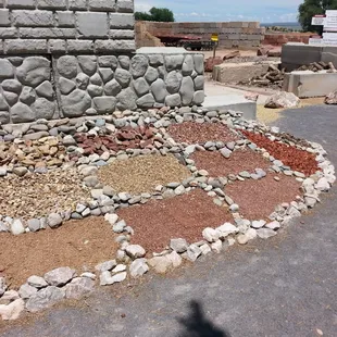 a stone wall and a pile of rocks