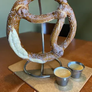 a pretzel with dipping sauce