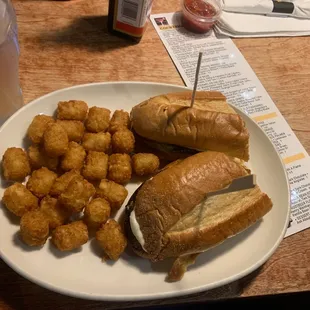 a sandwich and tater tots