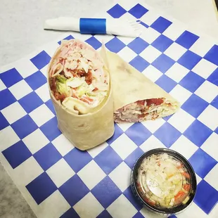 a wrap and a bowl of coleslaw
