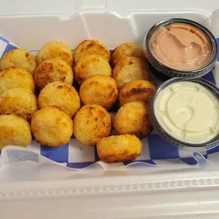 a tray of tater tots and dips