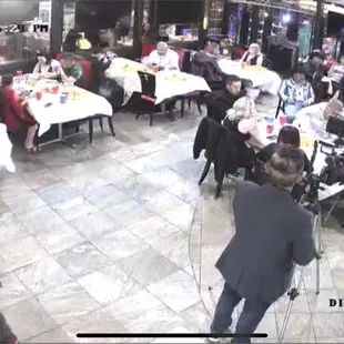 a man in a suit standing in a restaurant