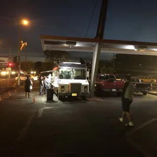 A brisk business between the two trucks...