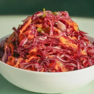 a bowl of red cabbage and carrots