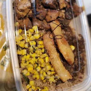 JERK CHICKEN BOWL with riceandpeas, corn and extra sauce on the rice... #homerdrool