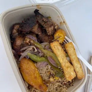 Jerk chicken with a mix of quinoa and the fried rice and plantains with yucca