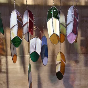 Stained glass feathers made in shop.