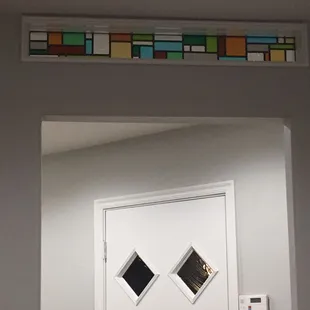 Custom order installed about doorway. Loving the color blocks...
