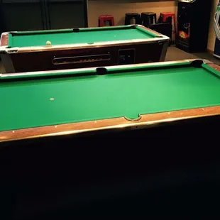We have two recently felted pool tables and what we&apos;ve been told are the best house cues in town!