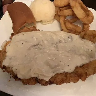 Chicken fried steak with onion rings &amp; mashed taters.