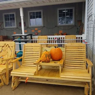 a porch with pumpkins